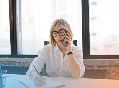 woman desk phone